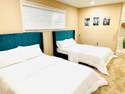 a bedroom with two beds and a window at Ocean Palace -12 Guests- close to I-75-Amazing Location!! in Maud