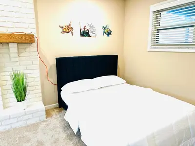 a bedroom with a bed and a window at Ocean Palace -12 Guests- close to I-75-Amazing Location!! in Maud
