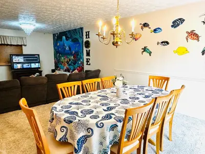 a dining room with a table and chairs at Ocean Palace -12 Guests- close to I-75-Amazing Location!! in Maud