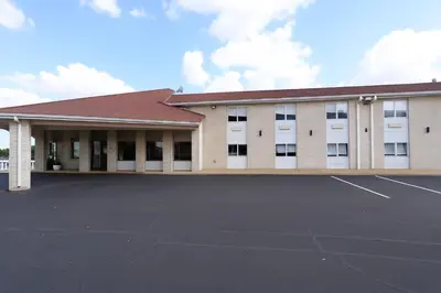 a large parking lot in front of a building at Days Inn by Wyndham Jackson in Jackson