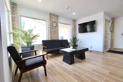 a living room with a couch and a table at Days Inn by Wyndham Jackson in Jackson