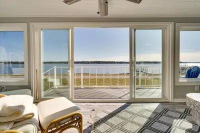 a living room with a view of the water at Waterfront Buckeye Lake Home with Deck and Dock! in Hebron