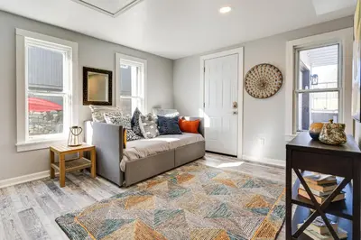 a living room with a couch and a table at Waterfront Buckeye Lake Home with Deck and Dock! in Hebron