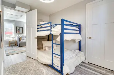 a bedroom with two bunk beds in a room at Waterfront Buckeye Lake Home with Deck and Dock! in Hebron