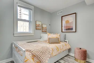 a bedroom with a bed and a window at Waterfront Buckeye Lake Home with Deck and Dock! in Hebron