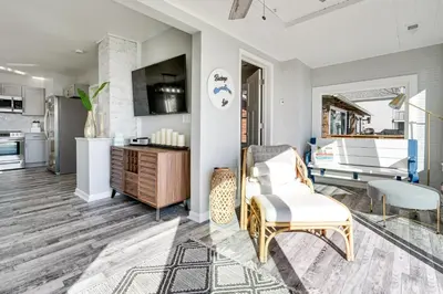 a living room with a couch and a table at Waterfront Buckeye Lake Home with Deck and Dock! in Hebron