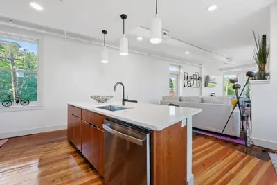 a kitchen with a sink and a counter top at Flatiron Bldg - Views - Amazing Cafe - Near to ALL in Cincinnati