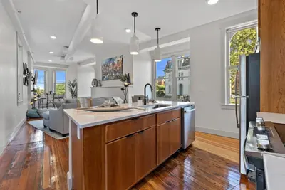 an open kitchen with a large kitchen island with a sink at Lux 1BR - Amazing Cafe - Views - Located near ALL in Cincinnati