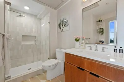 a bathroom with a sink and a toilet and a shower at Lux 1BR - Amazing Cafe - Views - Located near ALL in Cincinnati