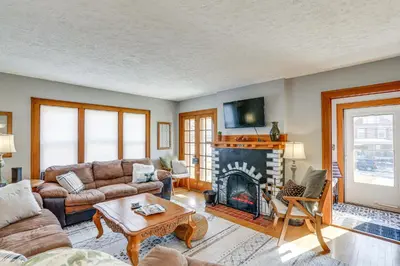 a living room with a couch and a fireplace at Cozy Tiffin House with Private Pool 1 Mi to Town! in Tiffin