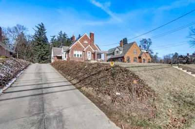 an empty street in front of a house at Cozy Tiffin House with Private Pool 1 Mi to Town! in Tiffin