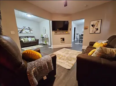 a living room with two couches and a tv at Elegant 4 Bed Room at Cleveland Clinic Area in Cleveland
