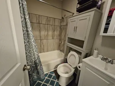 a small bathroom with a toilet and a sink at Elegant 4 Bed Room at Cleveland Clinic Area in Cleveland