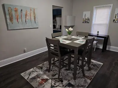 a dining room table and chairs in a room at Elegant 4 Bed Room at Cleveland Clinic Area in Cleveland