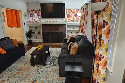 a living room with a couch and a fireplace at Lovely 3 Bed Room in Cleveland in Cleveland Heights
