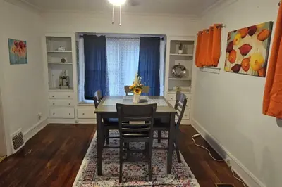 a dining room with a table and chairs at Lovely 3 Bed Room in Cleveland in Cleveland Heights