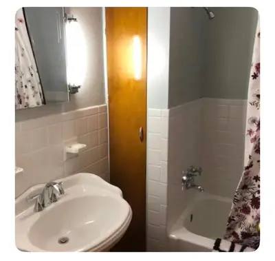 a bathroom with a sink and a toilet and a tub at Private suite near Cleveland Clinic in Shaker Heights