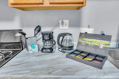 a box on a kitchen counter with a box of appliances at Historic Cozy Haven in Little Italy in Cleveland