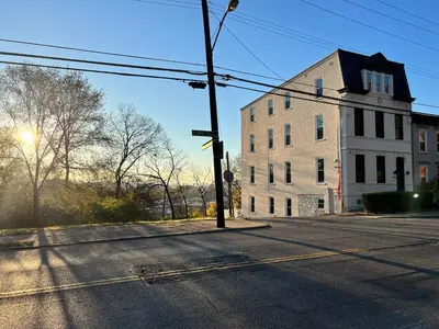 an intersection of an empty street with a white building at Skyline Retreat Spacious Elegance Queen Suite 1 City Views in Cincinnati