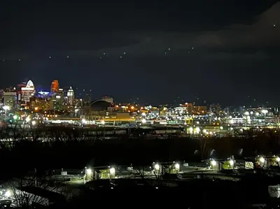 a view of a city at night with lights at Skyline Retreat Spacious Elegance Queen Suite 4 City Views in Cincinnati