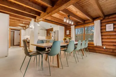 a kitchen and dining room with a table and chairs at WinklerWald- 6 BR family retreat in Atwater