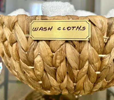 a wicker basket with a sign that reads wash c oats at Cozy 3 Bedroom Home in Reynoldsburg