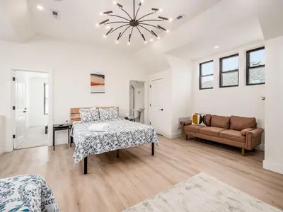 a white room with a bed and a couch at Modern Luxury 4BR 3 5BA Oasis in Historic Old Town East PD in Columbus