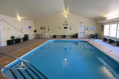 a large swimming pool in a large room at Hawthorn Extended Stay by Wyndham Seville in Seville
