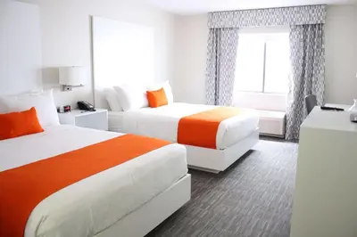 a hotel room with two beds and a window at Schoenbrunn Inn in New Philadelphia