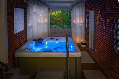 a bath tub in a room with a window at Refreshing Mid Mod Retreat BG in Bowling Green