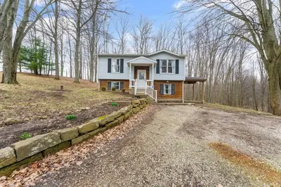 a home in the woods with a stone driveway at Come indulge and escape away! in Salem