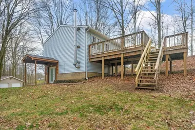 a house with a staircase on the side of it at Come indulge and escape away! in Salem