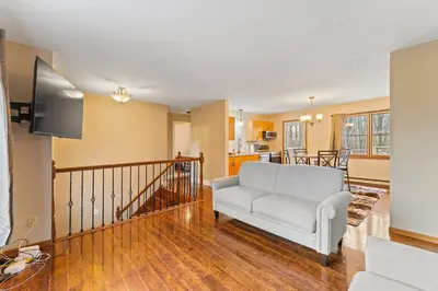 a living room with a couch and a tv at Come indulge and escape away! in Salem