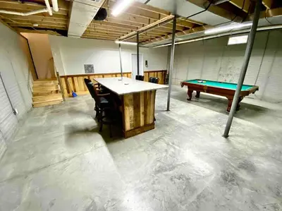 a room with a ping pong table and a pool table at 3 Bedroom in Hocking Hills w King Bed Logan Ohio in Logan