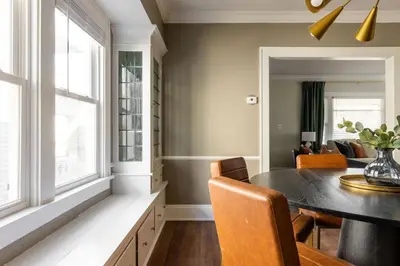 a dining room with a table and chairs at Modern 3BR Near Cleveland Clinic in Cleveland Heights