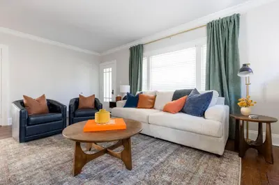 a living room with a couch and two chairs at Modern 3BR Near Cleveland Clinic in Cleveland Heights