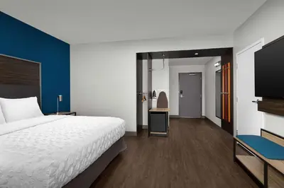 a hotel room with a bed and a tv at Tru By Hilton Columbus East Broad in Columbus
