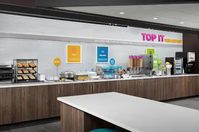 a counter in a restaurant with aasteryasteryasteryasteryasteryasteryasteryasteryastery at Tru By Hilton Columbus East Broad in Columbus