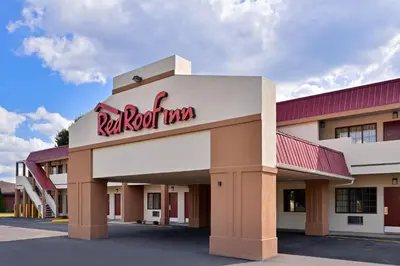 a red roof inn sign on the front of a building at Red Roof Inn Marietta in Marietta