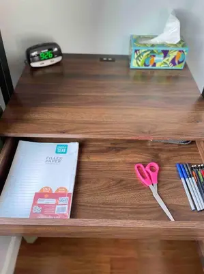 a table with a pair of scissors and a book at OTR, QUEEN Bed, 50in TV, Workspace, Near Lightrail in Cincinnati