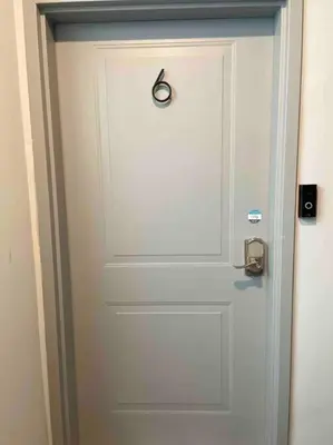 a white door with a door knob on it at OTR, QUEEN Bed, 50in TV, Workspace, Near Lightrail in Cincinnati