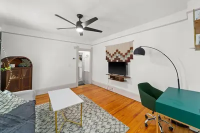 a living room with a couch and a table at Pet Friendly 2BR in Little Italy # 3 in Cleveland
