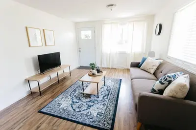 a living room with a couch and a table at Stylish & Cozy Home in Dayton-Close to Everything! in Dayton