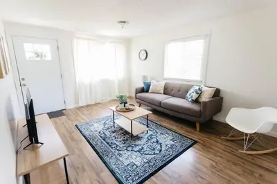 a living room with a couch and a table at Stylish & Cozy Home in Dayton-Close to Everything! in Dayton