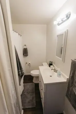 a white bathroom with a sink and a toilet at Stylish & Cozy Home in Dayton-Close to Everything! in Dayton