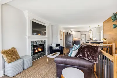 a living room with a couch and a fireplace at Hilltop Lakehouse - Free Kayaks Deck PLX in Akron