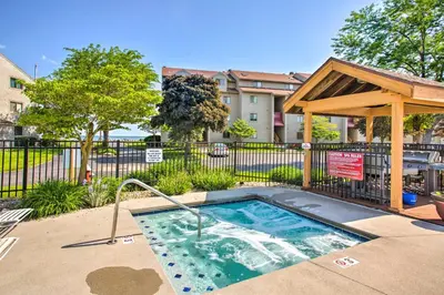 a small swimming pool with a gazebo in a yard at Lakefront Port Clinton Condo with Boat Dock and Slip! in Port Clinton