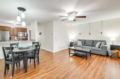 a living room with a couch and a table at Lakefront Port Clinton Condo with Boat Dock and Slip! in Port Clinton