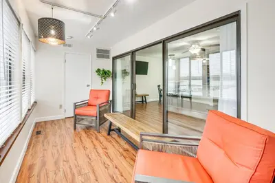 an office with a bench and orange chairs at Lakefront Port Clinton Condo with Boat Dock and Slip! in Port Clinton