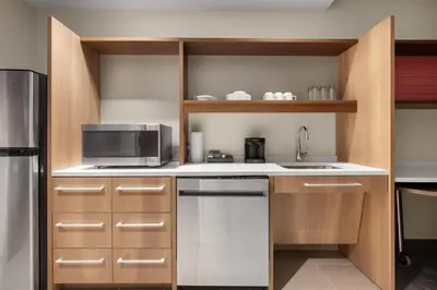 a kitchen with a sink and a microwave at Home2 Suites By Hilton Cincinnati Eastgate in Cincinnati